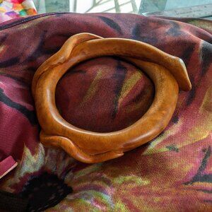Unusual Wooden carved snake bracelet curled around itself